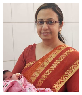 Dr. Shikha Tandon holding a newborn baby